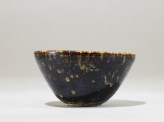 Black ware tea bowl with 'tortoiseshell' glazes