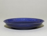 Dish with dragons under a cobalt-blue glaze