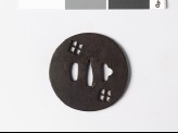 Lenticular tsuba with two karahana, or Chinese flowers