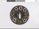 Round tsuba with cherry blossoms and karakusa, or scrolling plant pattern (EAX.10115)