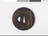 Round tsuba with vines and bamboo