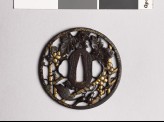 Round tsuba with grape vine and squirrel