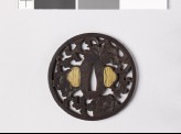 Round tsuba with peonies and a karakusa, or scrolling plant pattern