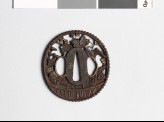 Tsuba in the form of a basket containing begonias and asters (EAX.10442)