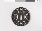 Round tsuba with tea whisks and karigane, or flying geese