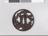 Round tsuba with chrysanthemum leaves and mon made from kiri, or paulownia leaves (EAX.10748)
