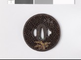 Round tsuba with rinzu, or swastika-fret diaper, and mon made from kiri, or paulownia leaves
