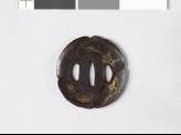 Tsuba in the form of overlapping clam shells, each depicting a bird or animal