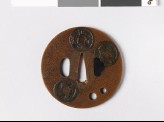 Round tsuba with Chinese coins