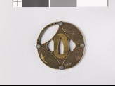 Round tsuba in the form of a shippō diaper, with Luck Objects