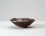 Black ware bowl with 'oil spot' glazes