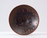 Black ware tea bowl with 'partidge feather' glazes (LI1301.286)
