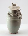 Greenware funerary jar and lid with dragon, bird, and a dog