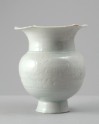 White ware vase with lobed rim and floral decoration
