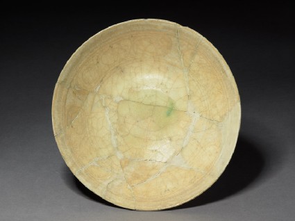 Bowl with scrollwork panels and concentric ringstop