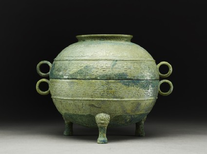 Ritual food vessel, or ding, with abstract and animal designs, and lidside