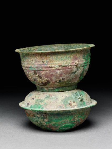 Ritual food vessel, or yan, with animal mask handlesside