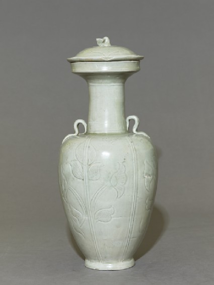 Greenware vase with floral decorationside