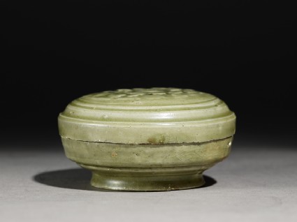 Greenware circular box and lid with floral decorationside