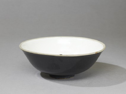 Black ware bowl with white interior and black exterioroblique