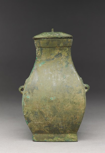 Square ritual wine vessel, or fang hu, with animal mask handlesside