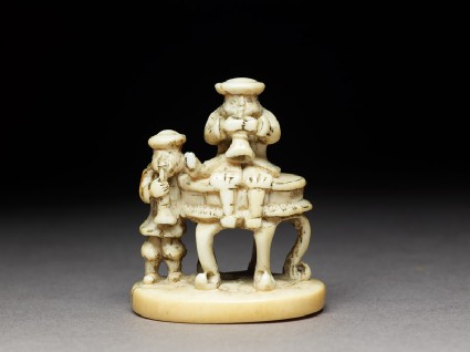 Netsuke in the form of two men playing wind instrumentsfront