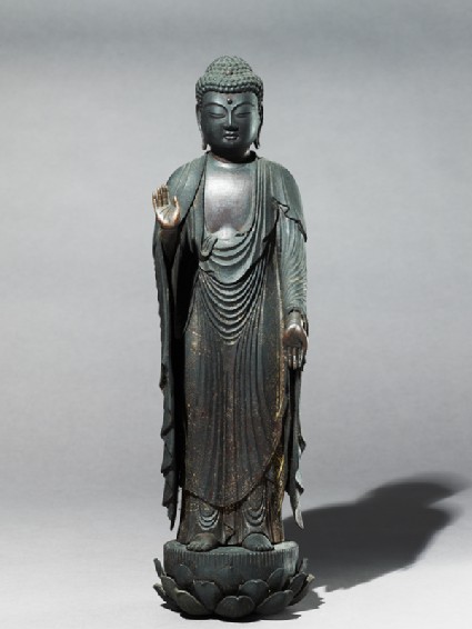 Standing figure of the Buddhaside
