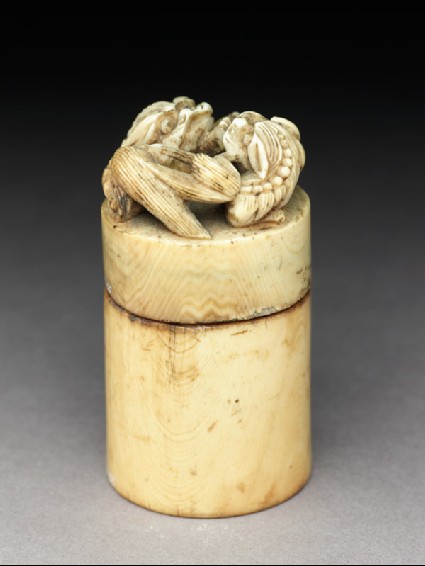 Ivory seal and box surmounted by two lions and with the legend 