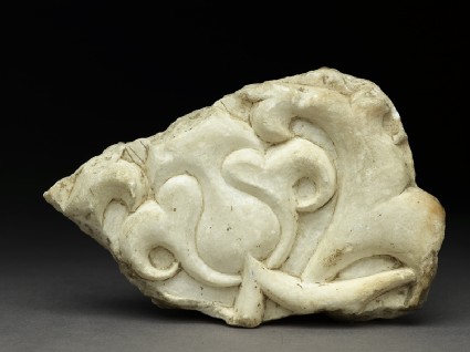 Fragment of an architectural frieze with lotus blossom and half-palmettefront