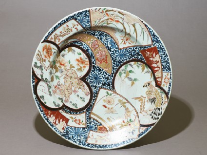 Dish with a shishi, or lion dog, amid animals and flowerstop