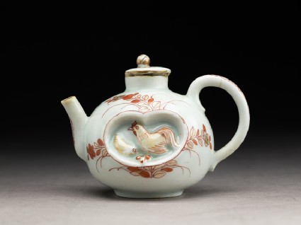 Small teapot with chickens and plantsside