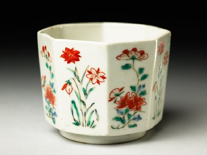 Octagonal cup with peony sprays and flowering plantsoblique