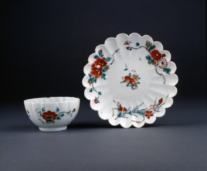 Fluted cup and saucer with floral decorationgroup