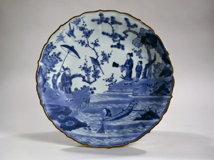 Foliated dish with figures in a landscapetop