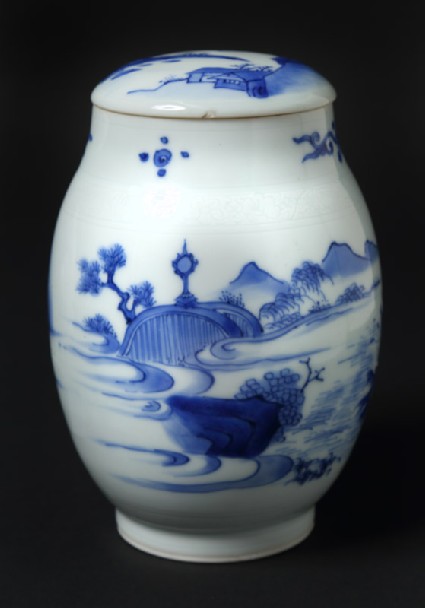 Blue-and-white jar and lid with immortal floating above a tree trunkfront