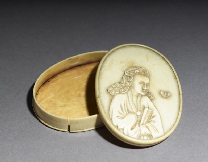 Ivory box with figure holding a fanoblique, open