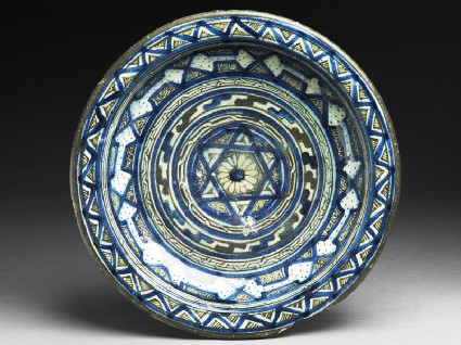 Dish with central six-pointed star and concentric bands of geometric decorationtop