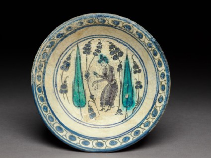 Saucer with turbaned figure between two cypress treestop