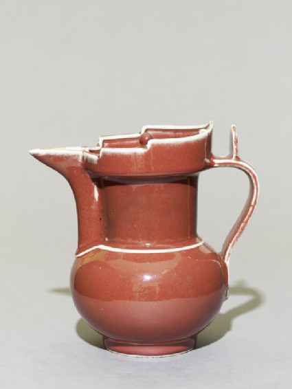Porcelain ewer in the form of a Tibetan monk's capside