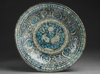 Dish with hares against a foliate backgroundtop