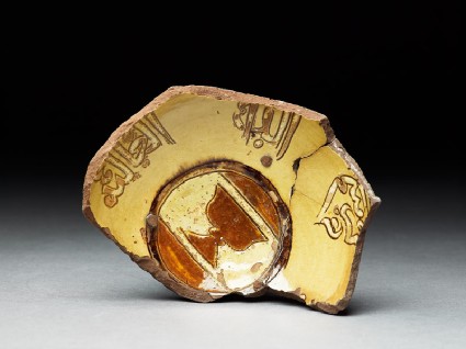 Base fragment of a bowl with cupbearer's emblemtop
