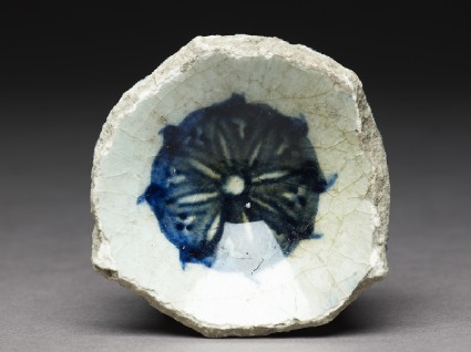 Base fragment of a bowl with blue rosettefront