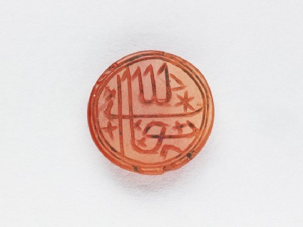 Circular bezel seal with inscription in cursive script and star decorationfront