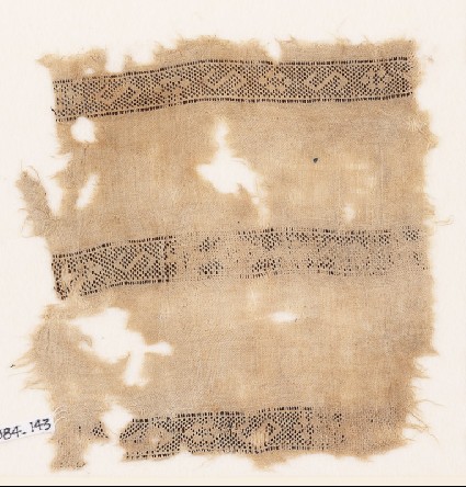 Textile fragment with bands of S-shapes and squaresfront