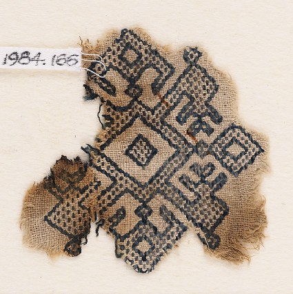 Textile fragment with diamond-shapes, inverted hooks, and arrowheadsfront