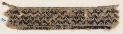 Textile fragment with chevrons and circlesfront