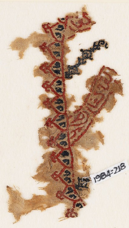 Textile fragment with linked crenellations and inscriptionfront
