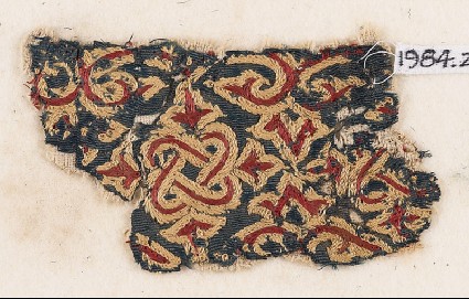 Textile fragment with knotted interlace, trefoils, and leavesfront
