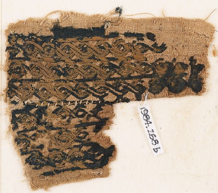 Textile fragment with bands of interlaced braidfront