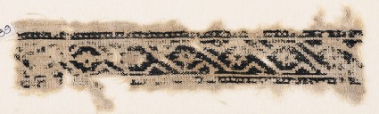 Textile fragment with linked scroll and rosettesfront